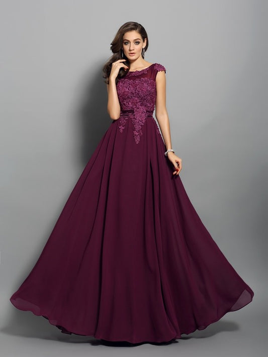 Vestido de noche de graduación de gasa largo sin mangas con apliques redondos y corte A/princesa