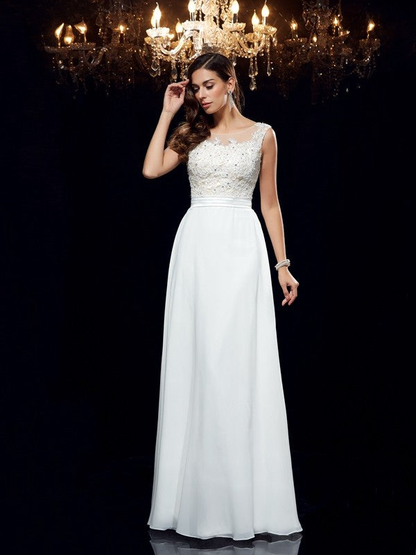 Vestido de noche de graduación de gasa largo sin mangas con apliques redondos y corte A/princesa