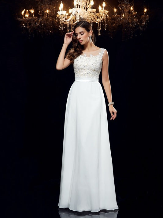 Vestido de noche de graduación de gasa largo sin mangas con apliques redondos y corte A/princesa