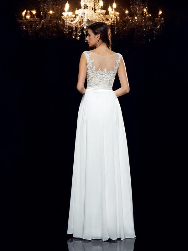 Vestido de noche de graduación de gasa largo sin mangas con apliques redondos y corte A/princesa