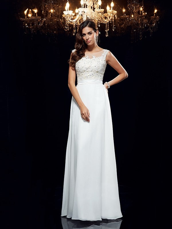 Vestido de noche de graduación de gasa largo sin mangas con apliques redondos y corte A/princesa