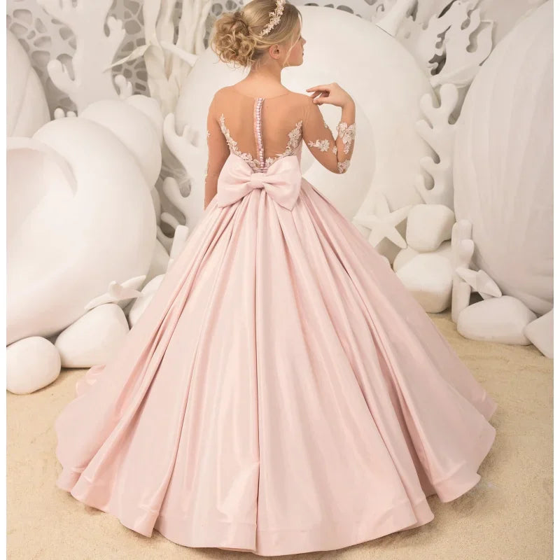 Vestidos de niña de las flores personalizados con estampado floral blanco y satén rosa con lazo de manga larga para bodas, fiestas de cumpleaños y banquetes. 