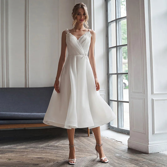 Short Wedding Dress 2027 A Line V Neck Simple Wedding Gown White Organza Satin Backless Tea Length Sleeveless Midi Bridal Dress